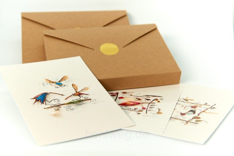 Ten motifs from my miniature collages in postcard format in a gift box