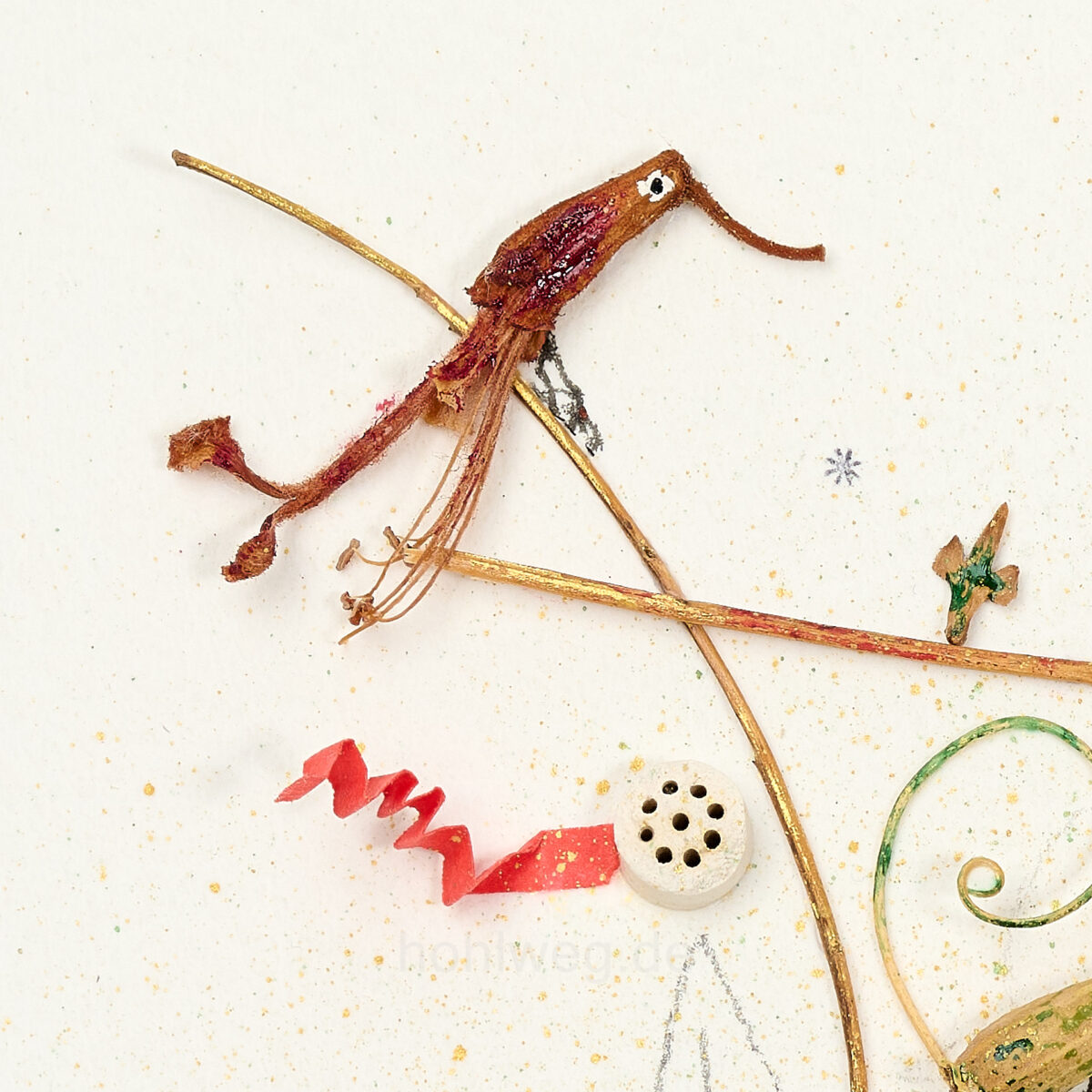 Detail from the assemblage "The Navel of the World," featuring plant remains, ceramic cigarette filters, and a piece of paper